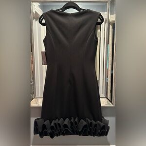 Donna Rocco black cocktail dress new with tags. Size 4.